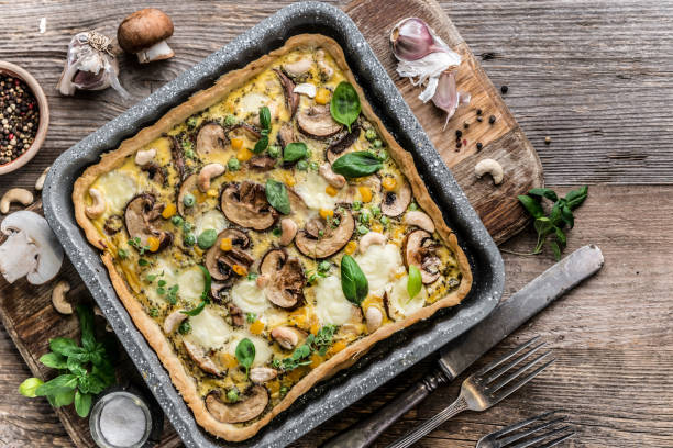 istock Homemade mushrooms pie on a wooden background. 885421386