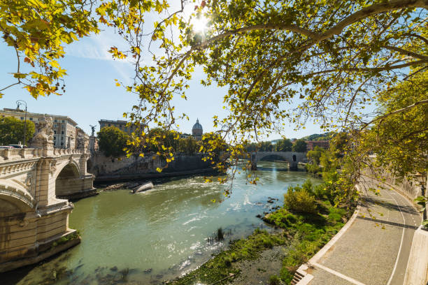 istock Sun shining over Tiber river in Rome 885421388