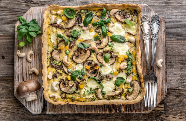 istock Homemade mushrooms pie on a wooden background. 885421486