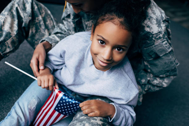 istock daughter with american flag 885421568