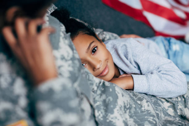 istock daughter with mother in military uniform 885421730