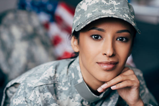 istock female soldier in military uniform 885426082