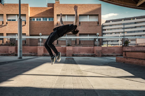 istock Man practicing parkour in the city 885426446