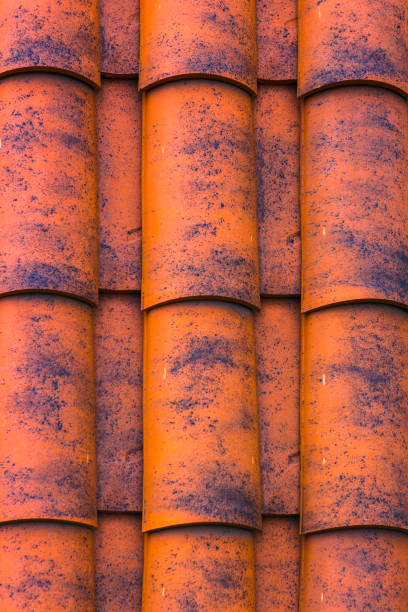 istock Red plastic roof tiles home 885432320