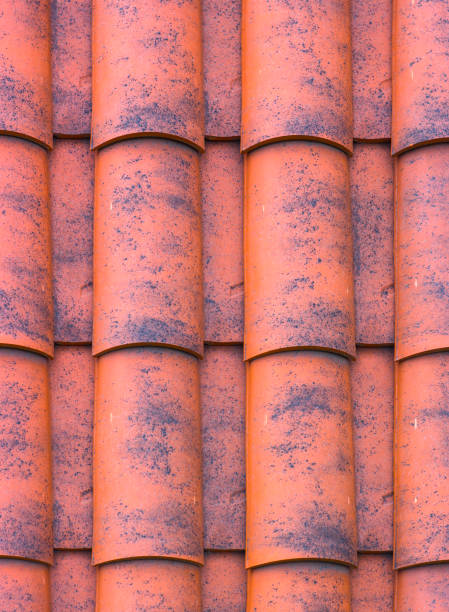 istock Red plastic roof tiles home texture 885432488