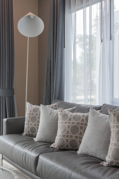 istock modern living room with row of pillows 885436194