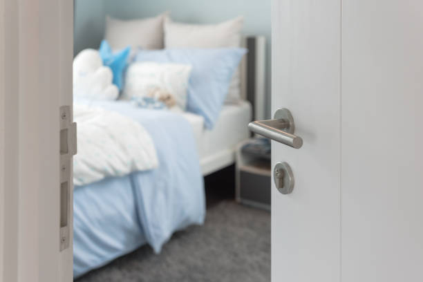 istock opened white door to bedroom 885436202