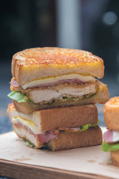 istock Close up chicken cordon bleu sandwich. (selective focus) 885436226