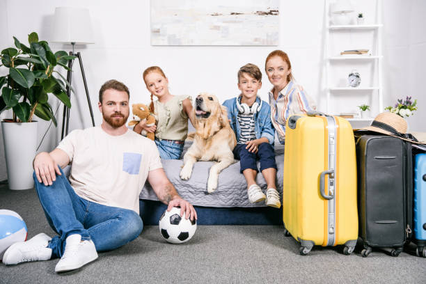 istock family with dog ready for trip 885441044