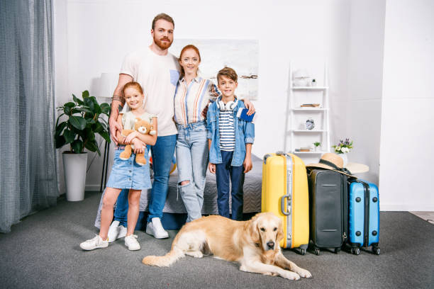 istock family with dog ready for trip 885441100