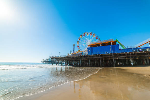 istock Sun shining over Santa Monica pier 885443334
