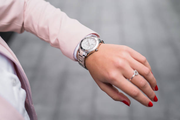 Young businesswoman checking time. Close-up.