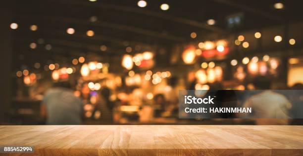 Wood Table With Blur Light Bokeh In Dark Night Cafe Stock Photo - Download Image Now