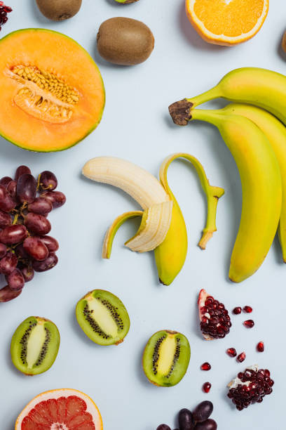 istock Fruit flat lay from above colorful food background 885461460