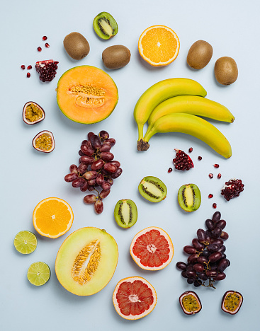 Fruit flat lay from above colorful food background