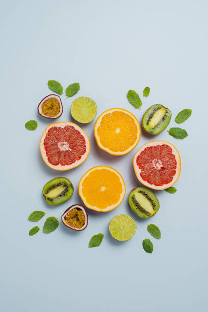 istock Citrus fruit flat lay from above colorful food background 885481584
