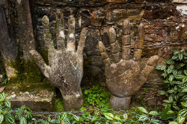 Old effigy of shaking hands in marble