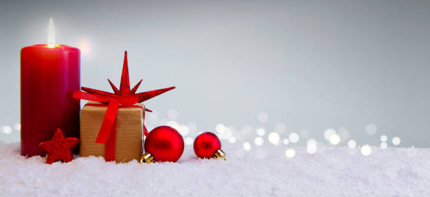 istock Christmas background with Advent candle and gift box isolated 885499306