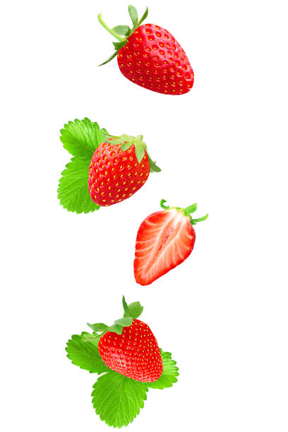 Isolated falling strawberries on white stock photo