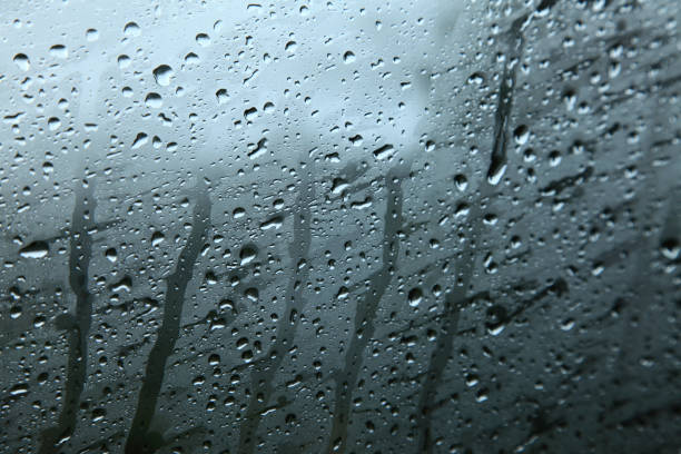 istock Water drops on window pane after rain. Selectively focused 885515326