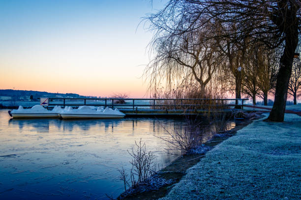 A small frozen pond in the early morning after an icy night in Limburg, south Netherlands.