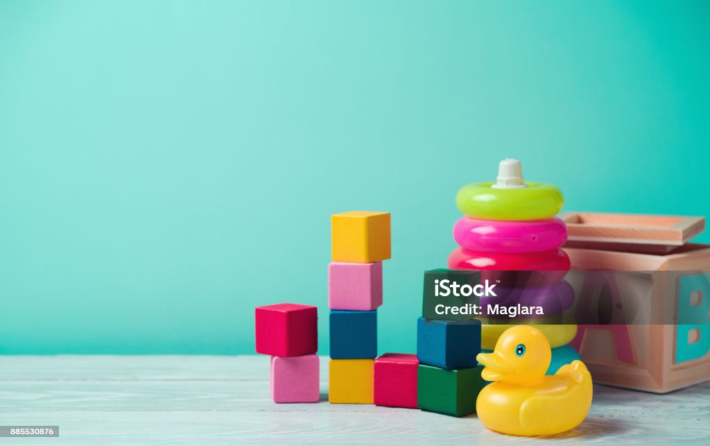 Baby toys on wooden table Baby toys on wooden table. Child development concept Toy Stock Photo