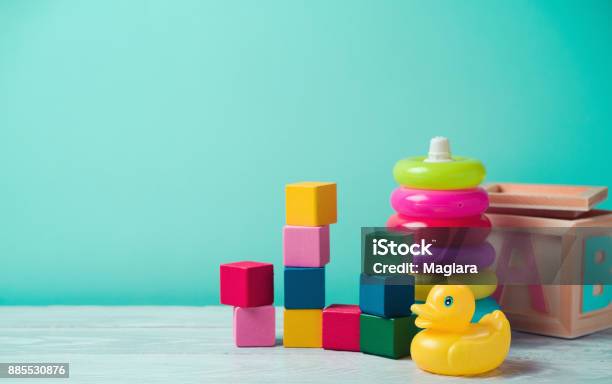 Baby Toys On Wooden Table Stock Photo - Download Image Now - Toy, Baby - Human Age, Child