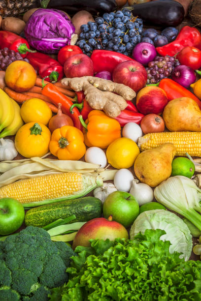istock Vegetables and fruits large mix group overhead on colorful background 885537186