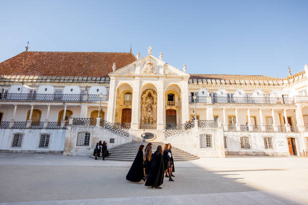 Coimbra city in Portugal COIMBRA, PORTUGAL - September 26, 2017: View on the courtyard of the oldest university with students in black uniform in Coimbra city in the central Portugal coimbra city stock pictures, royalty-free photos & images