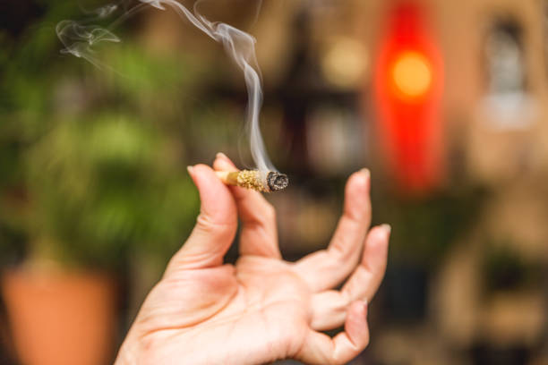 istock Smoking Joint in Woman's Hand 885552270