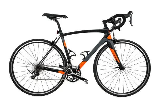 Side view of black, gray and orange carbon fiber bicycle isolated on a pure white background.