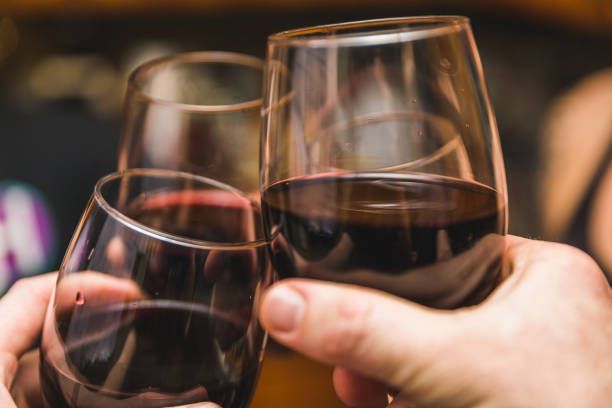 Three Wine Glasses Touching stock photo