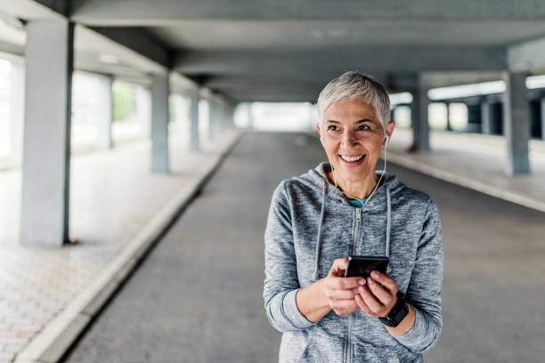 istock Woman with headphones preparing for a jogging 885559778