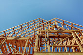 istock Interior framing of a new house under construction 885566710