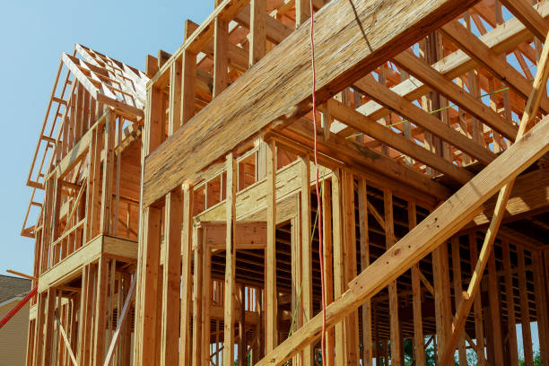 istock Abstract of New Home Construction Site Framing. 885566746