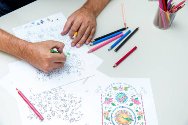 istock Close Up Mature Man Hands Coloring 885574450