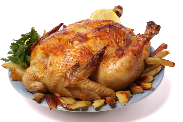 istock Grilled chicken on plate isolated on white background 885574496