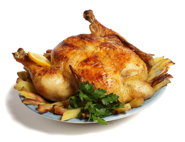 istock Grilled chicken on plate isolated on white background 885574544