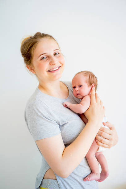 istock Mother with her baby 885574816