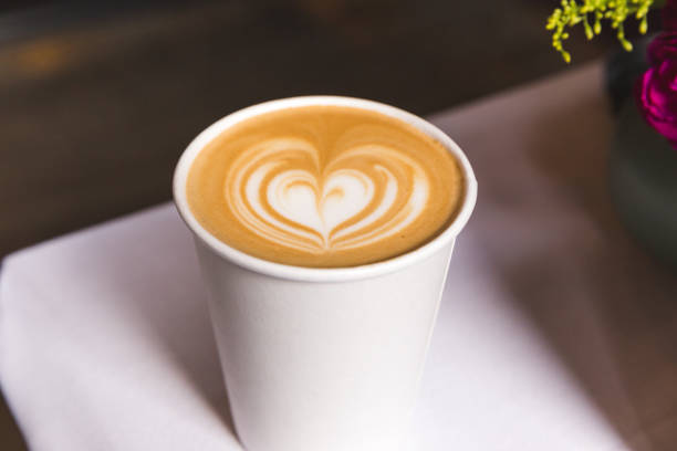 Coffee in Paper Cup with Heart Design stock photo