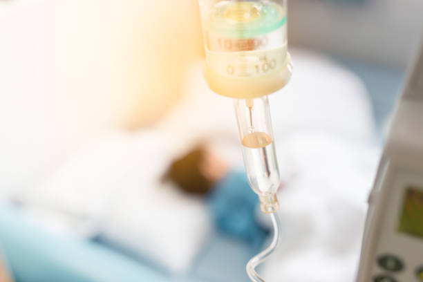 Sick child sleep on the bed in hospital during have a saline drip. Sick child sleep on the bed in hospital during have a saline drip cancer illness stock pictures, royalty-free photos & images