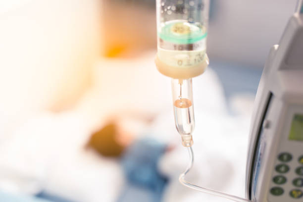 istock Sick child sleep on the bed in hospital during have a saline drip 885586932