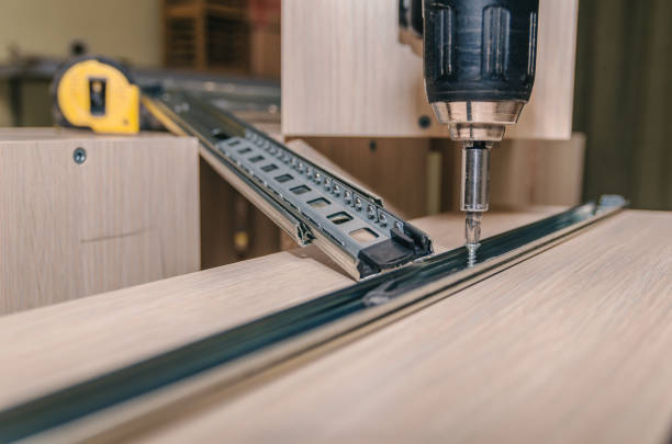 istock Assembling of furniture closeup 885592884