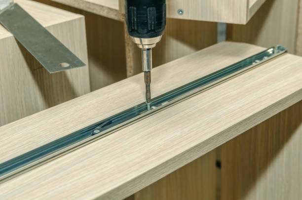 istock Assembling of furniture closeup 885592888