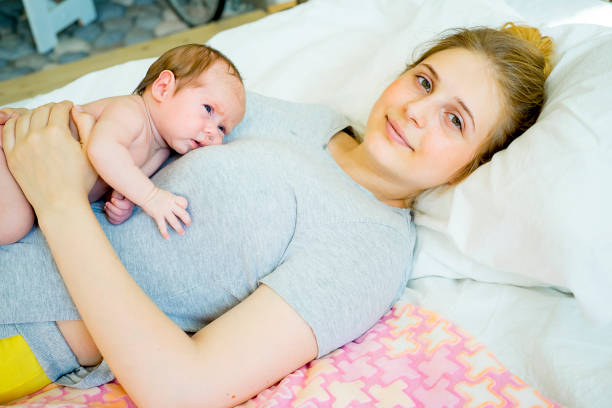 istock Mother with her baby 885602824