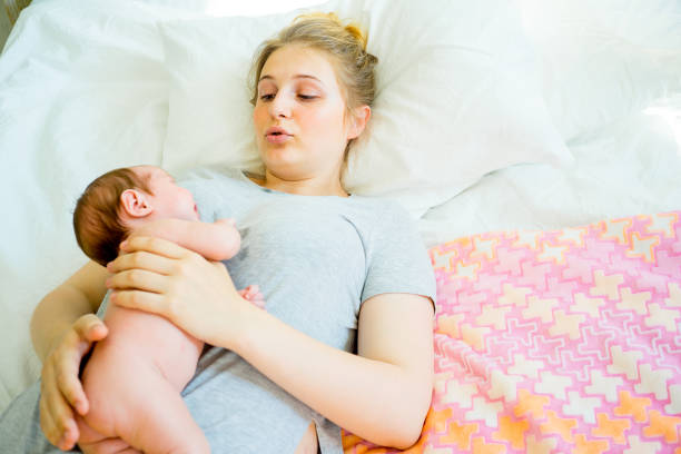 istock Mother with her baby 885602982