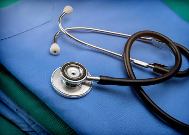 istock Stethoscope about blue and green nurse uniform in a hospital, conceptual image 885606578
