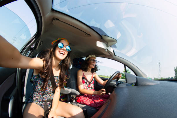 istock Women having fun in a road trip 885616888