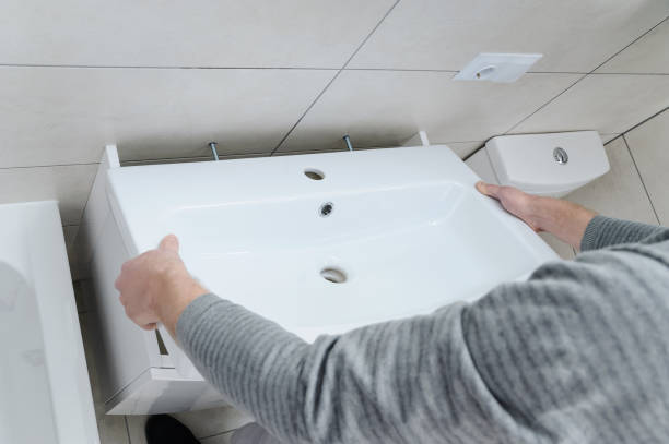 istock Installation the washbasin in the bathroom. 885620472