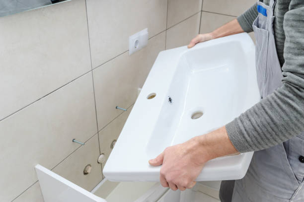 istock Installation the washbasin in the bathroom. 885620476